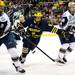 Michigan freshman right wingman Andrew Copp chases after a puck in the game against Notre Dame on Sunday, March 24. Daniel Brenner I AnnArbor.com